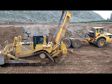 Volvo A45G articulated haulers dumping Rock - D8T Dozer pushing