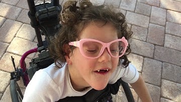 Angela initiating conversation using PODD and auditory scanning