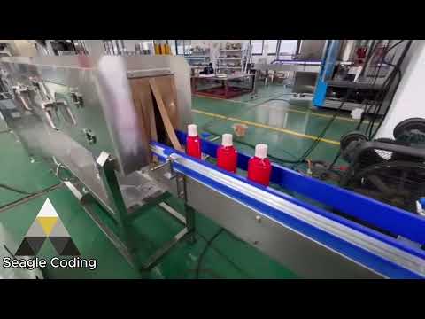 Bottle sleeving machine and steam shrink tunnel on a packaging line