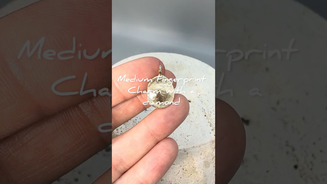 Medium Fingerprint Charm in 14k yellow gold with a diamond made with child’s imprint 