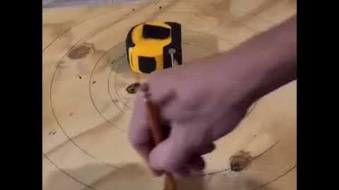Drawing a circle with a tape measure and a nail