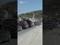 Lebanese residents flee on bridge after 18 killed by Israeli airstrikes