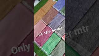 premium satin double jari fabric featuring rich floral zari weaving on a vibrant red base.
