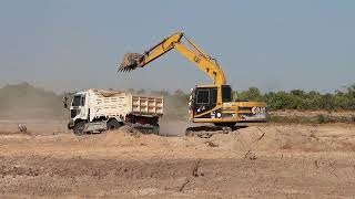 Digging land in to dump truck in Cambodia 08