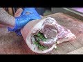 Stuffed Fat Pork Belly the Italian Way. Preparing "Porchetta". London Street Food