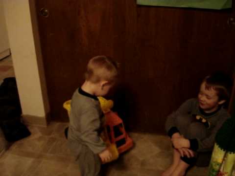 cute little boys in their batman jammies playing