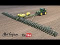 Huge john deere db120 48 row 30 120 wide corn planter in action in michigan