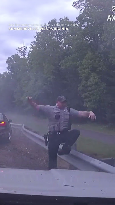 Dashcam video shows officer on side of road narrowly escape careening BMW #Shorts