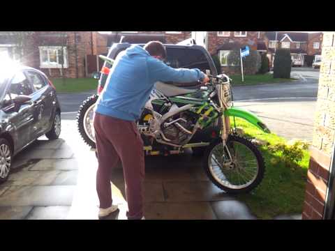 loading-a-dave-cooper-bike-carrier-bike-rack-(put-straps-on-afterwards)