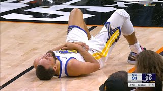 Dillon Brooks takes a swing at Steph Curry and hits him in the stomach after he contested 3 by Curry