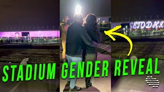 Gender Reveal Party Held by a Stadium as the Screen Counts Down Then Reveals Color