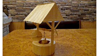 картинка: колодец из деревянных палочек с ведерком