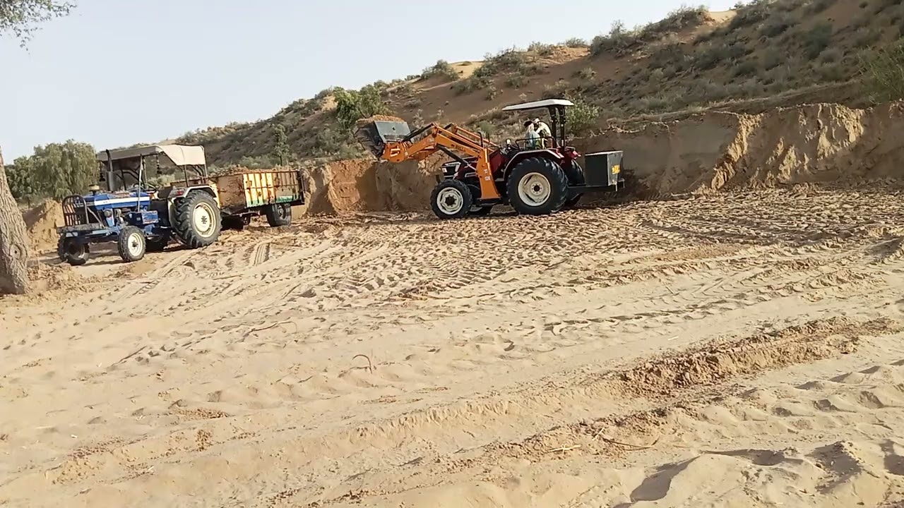 soil trolley loading by tractor loader 