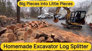 Firewood splitting with Caterpillar 302.5 mini excavator and homemade attachment
