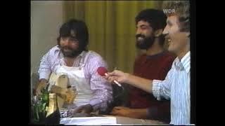 Lowell George explains and demonstrates basics of slide guitar playing (1977)