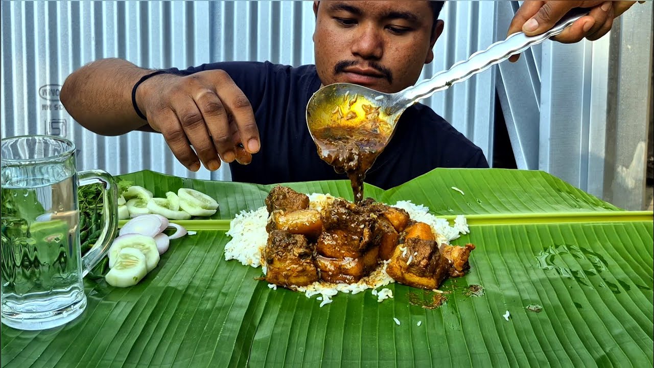 EATING SPICY LOCAL PORK GRAVY WITH BASMATI RICE 