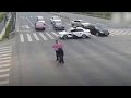 Chinese Supercop Goes Viral After Stopping Traffic to Help Old Man Cross the Street