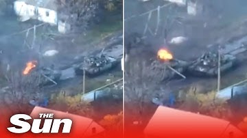 Russian T-80 tank drives away whilst on fire forcing troops inside to flee Russian T-80 tank drives away whilst on fire forcing troops inside to flee