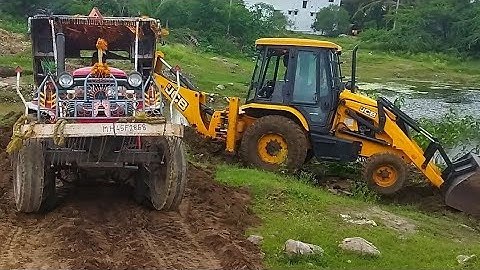 jcb backhoe machine going to soil loading Mahindra Arjun tractor ll jcb video