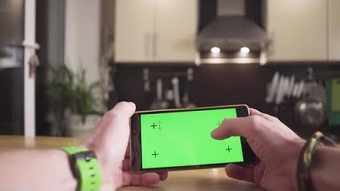 Male Hand Scrolling a Smartphone with Green Screen | Stock Footage - Videohive