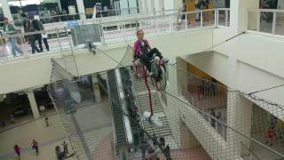 The high wire bicycle rests precariously on a guide suspended across
an open expanse of california science center's grand atrium. as
visitors mount for "ride," they peer down to ...
