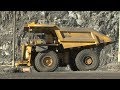 Graders and Bulldozers Smooth Gold Mine Roads For Passing Haul Trucks, Biggest Machines In The World