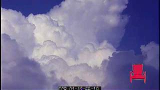 Time-lapse of the sky with puffy clouds.
