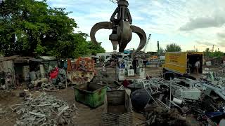 how a heavy equipment operator works at a scrap yard