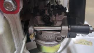 Carburetor adjustment screws for Honda HR 214 mower.