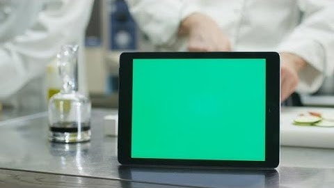 Tablet with Green Screen Mock-up on Kitchen Table | Stock Footage - Videohive