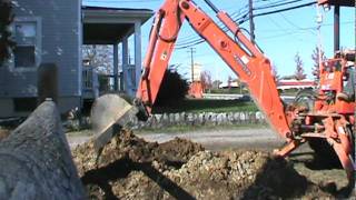 Kubota L48 digging ditch