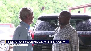 Georgia Senator Raphael Warnock visits with farmers in Keysville