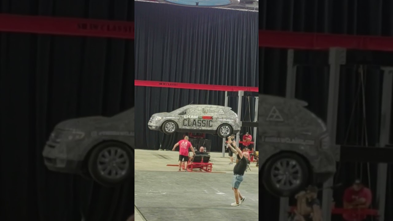 Brian Shaw leg pressing a SUV 14 times 