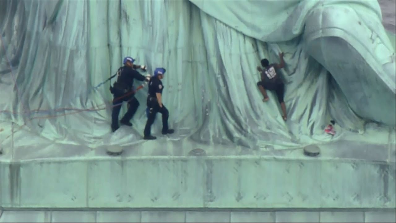 Protest Climber Removed From Statue of Liberty YouTube
