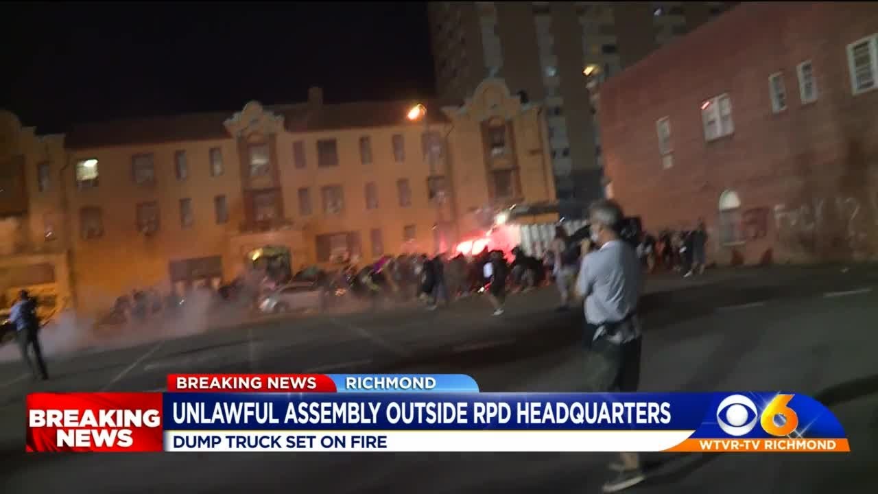 Richmond rioters set dump truck outside police headquarters - YouTube