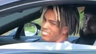 xxxtentacion throwing gang signs in his car