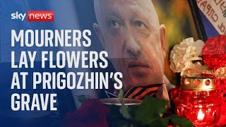 Mourners lay flowers following Wagner boss Yevgeny Prigozhin's private funeral