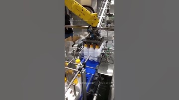 Milk bottle automatic sorting feeding robot hand cartoning machine encasing line testing video