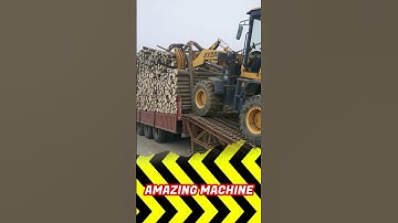 lifting unloading a bundle of long wooden logs from the back of a truck #truck