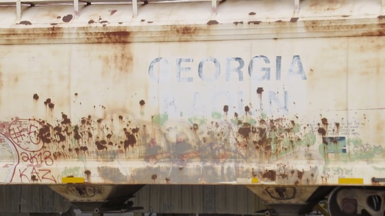 Ex-GEORGIA KAOLIN ACF Center Flow covered hopper on the spur track at Harborlite plant in Michigan