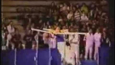 parallel bars.back uprise to handstand with 1/2