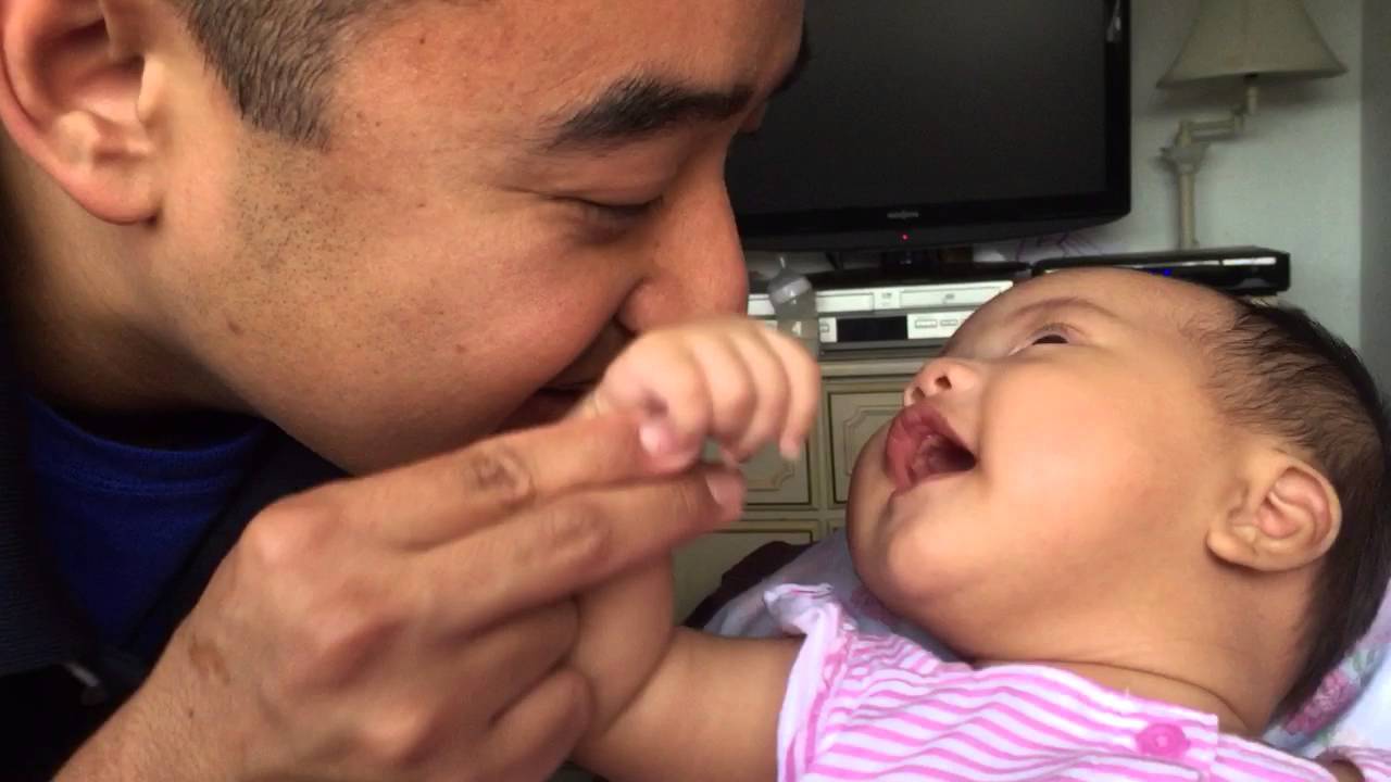 Melia touching daddy's face