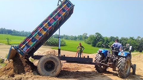 Soil is load from the pond into tractor and unload over rough hills through hydraulic facilities.