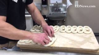 Watch closely as Stephen Ferraro twists pretzels at Lebanon's Philly Pretzel Factory on Saturday mor screenshot 2