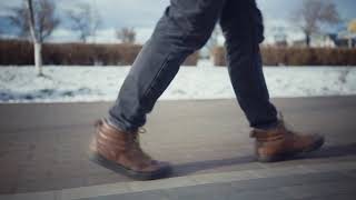 closeup man feet legs walking at winter