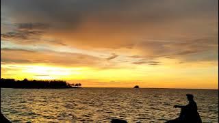 Story WA slow motion sunset di tepi pantai