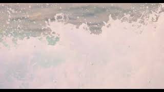 Close up of Moving and Splashing Sea Wave in Slow Motion screenshot 3