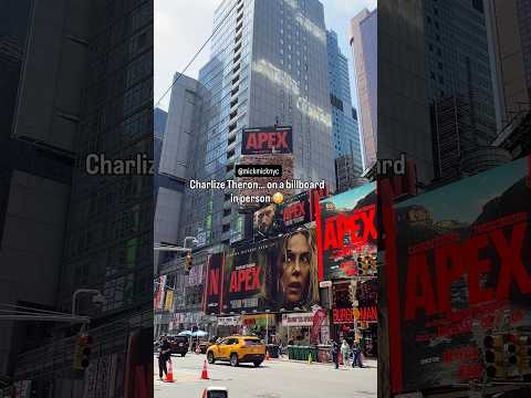 Charlize Theron is literally on a Times Square billboard 🤯 Apex premiere