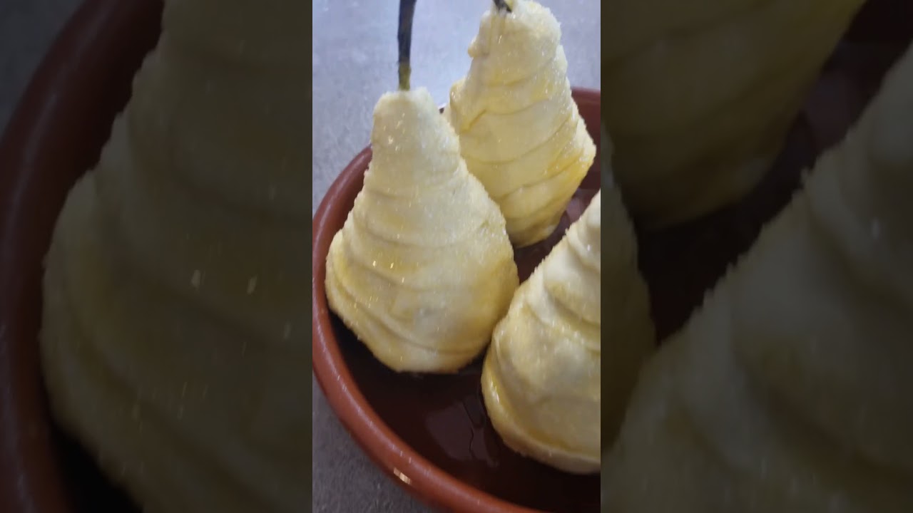 Delicious caramelized Pear in batter baked in a clay pot outside 