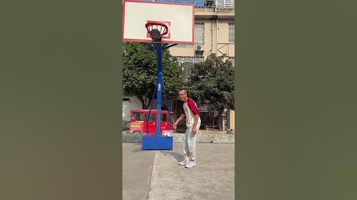 You must not wear slippers to play basketball on the street court. Sports. Streetball. Shooting.